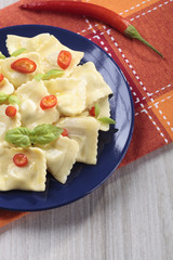 Portion of ravioli with red pepper
