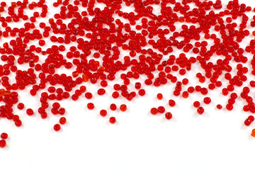 Red beads on white floor