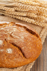 Loaf of bread with wheat ears