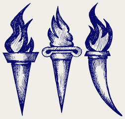 Set of flaming torches. Doodle style
