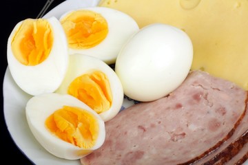 half boiled eggs with ham and cheese