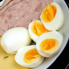 half boiled eggs with ham and cheese