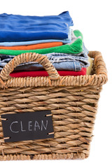 Washed fresh clean clothes in a laundry basket