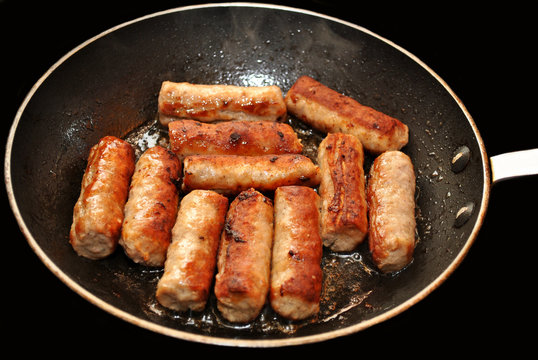 Breakfast Sausage Links Frying In A Pan