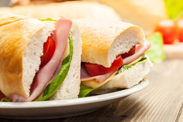 Italian panini sandwich with ham, cheese and tomato