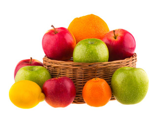 Red and green apples, oranges and lemons in a wooden basket