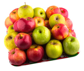 Fresh green, yellow and red apples on a tray. Isolated