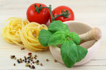 Fresh basil, pasta, tomatoes and pepper