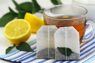 Tea bags, tea and fresh lemon