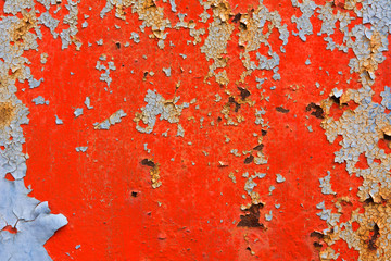 Peeling paint on rusty metal plate