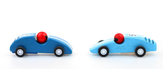 Toy racecars racing towards each other