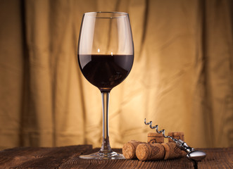 corkscrew   and wine glass
