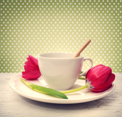 Coffee cup with red tulips