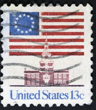 Postage stamp printed in the USA, shows the national flag