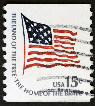 Postage stamp printed in the USA, shows the national flag