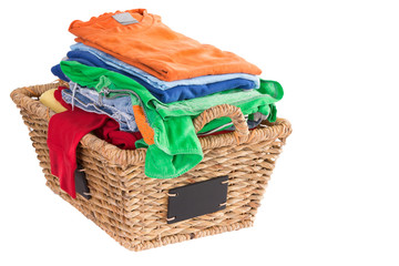 Clean washed fresh summer clothes in a basket
