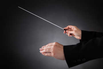 Female Orchestra Conductor With Baton