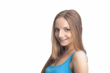 smiling and Happy Blond Girl With Brackets on Her Teeth