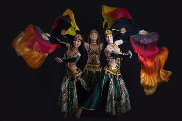 Image of young graceful oriental dance performers