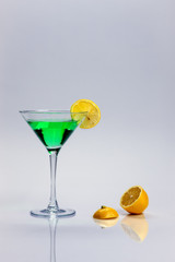 Green liquor and a lemon.