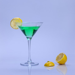 A cocktail with lemon.