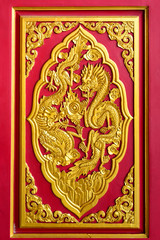 Golden chinese dragon pattern on a temple's door