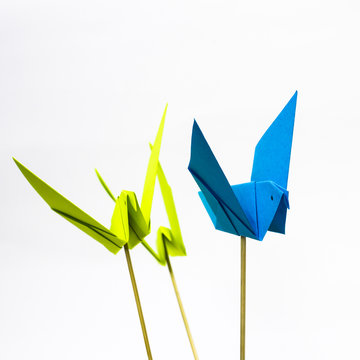 Origami bird with stick bottom it to look like it fly.