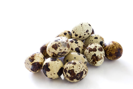 Quail eggs isolated on white background