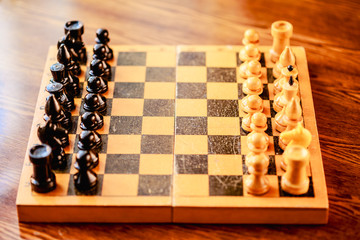 Ancient wooden chess standing on chessboard © Great Brut Here