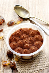 Tiramisu dessert on wooden table. Italian confectionery