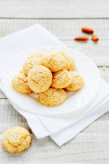 cookies with almonds on a white plate