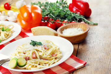 Pasta carbonara on the wooden table