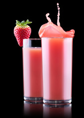 Smoothies of strawberry in glass with splash