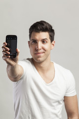 young attractive man taking self pictures wit his phone