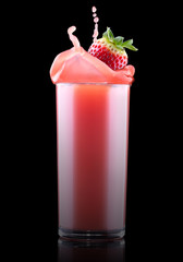 Smoothies of strawberry in glass with splash