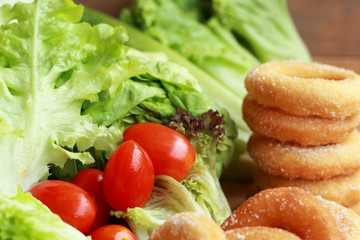 donut and sugar - fresh vegetable salad.
