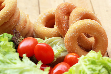 donut and sugar - fresh vegetable salad.