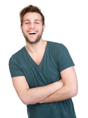 Man laughing with arms crossed on
