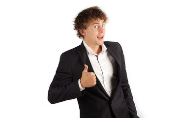 Studio shot of business man showing thumbs up sign