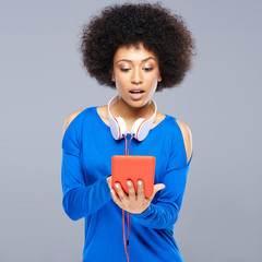Beautiful young woman selecting a tune