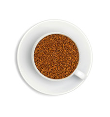 granules of instant coffee in a white cup and saucer isolated on