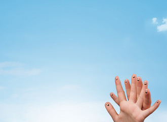 Happy smiley fingers looking at clear blue sky copyspace