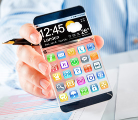 Smartphone with transparent screen in human hands.