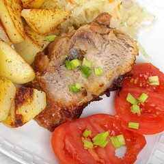 pork with roasted potatoes, tomatoes and sauerkraut