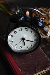 Retro Alarm Clock on an old book
