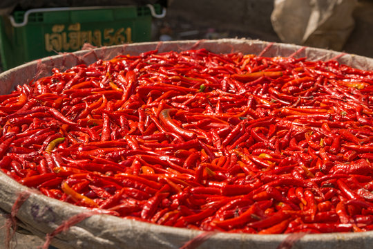 small, red, very  spicy chilli peppers on an asian market.