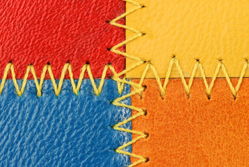 four pieces of leather sewn together