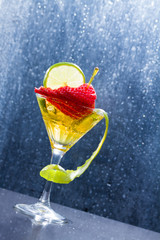 Cocktail with fresh lime and strawberry