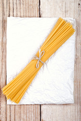 spaghetti on white paper