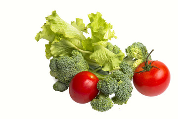 fresh broccoli and tomatos on a white background